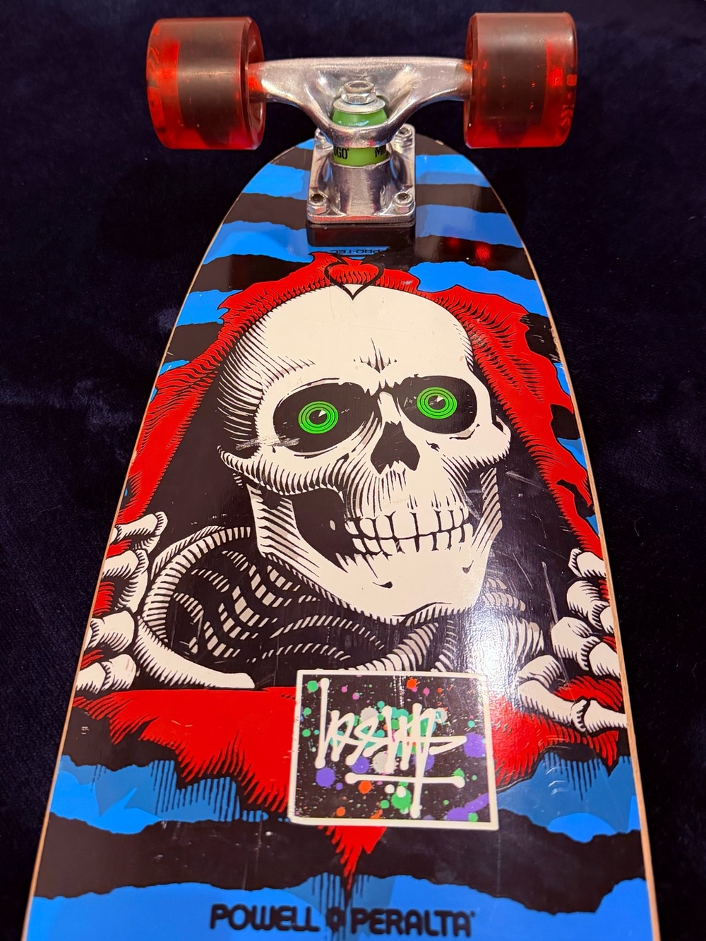 Powell Peralta Kids Skateboard with Red & Blue Skull Graphic